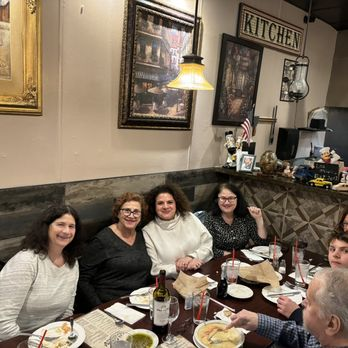 Guests gathered around a table at Los Olivos Ristorante