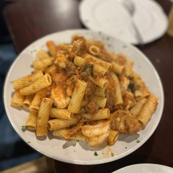 Rigatoni pasta with sausage, shrimp and tomato sauce